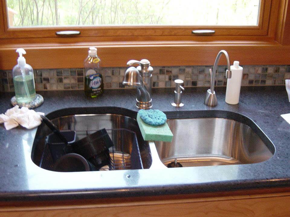 Custom kitchen sink installation with high quality fixtures in a Montana home